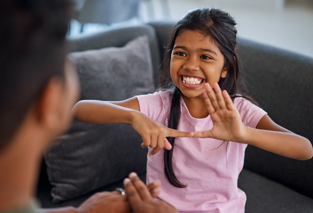 Child,,Sign,Language,And,Learning,To,Communicate,With,Deaf,Girl